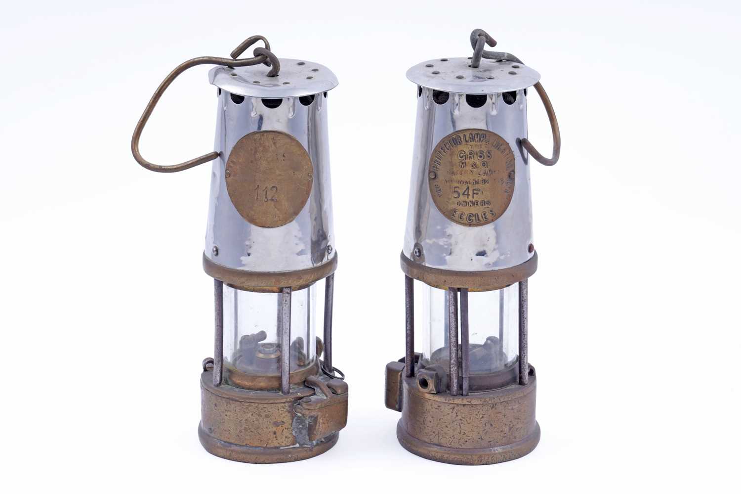 Lot 216 - Two Type 6 'The Protector Lamp & Lighting Co Ltd Eccles' miners' lamps