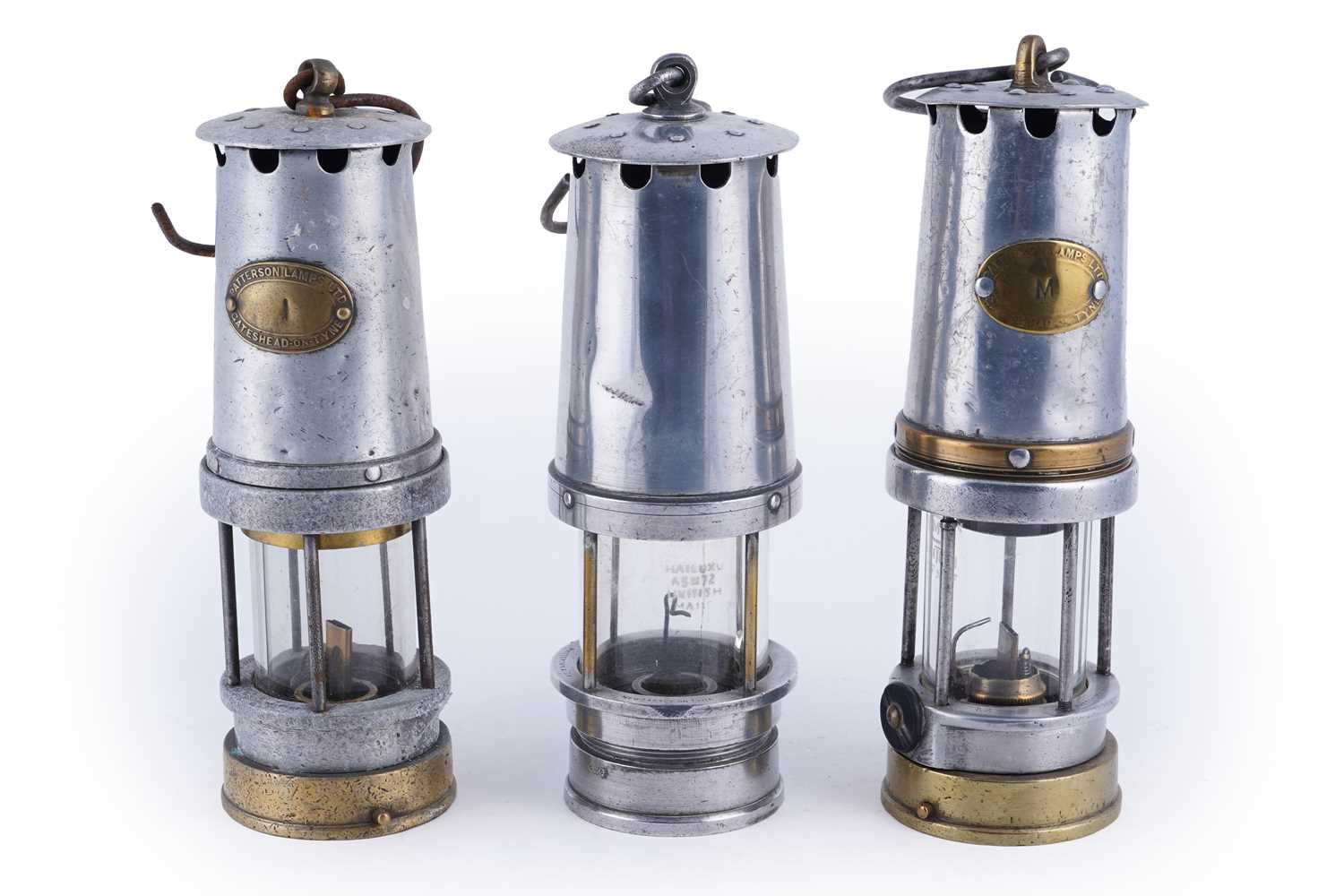 Lot 246 - Two Patterson Type A lamps; and another Patterson & Co lamp
