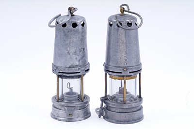 Lot 261 - Two aluminium and brass John Mills & Sons Newcastle ‘Guys Shield’ type lamps
