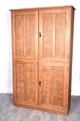 Lot 77 - A 20th Century Arts & Crafts-style oak school cupboard