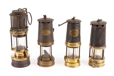 Lot 248 - A collection of four Patterson miner's lamps