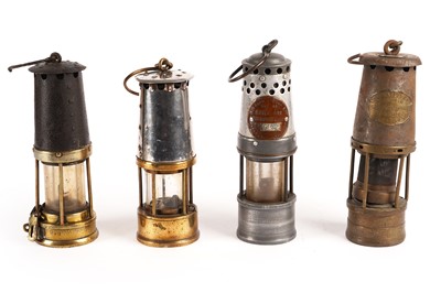 Lot 246 - A collection of miner's lamps