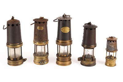 Lot 249 - A collection of five miner's lamps