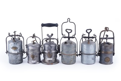 Lot 231 - A collection of six early 20th Century carbide lamps