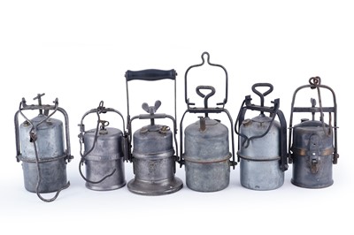 Lot 231 - A collection of six early 20th Century carbide lamps