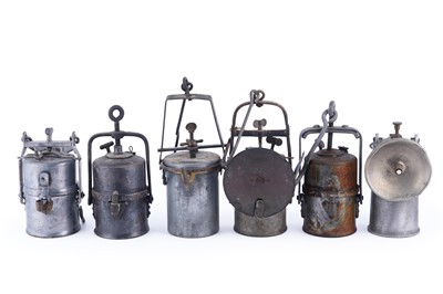 Lot 219 - A collection of six early 20th Century carbide lamps