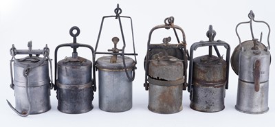 Lot 219 - A collection of six early 20th Century carbide lamps