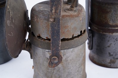 Lot 219 - A collection of six early 20th Century carbide lamps