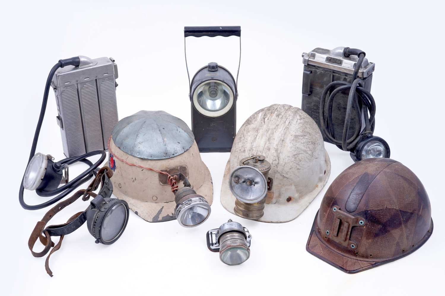 Lot 159 - Three helmets; and a collection of electric lights