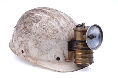 Lot 159 - Three helmets; and a collection of electric lights