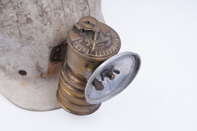 Lot 159 - Three helmets; and a collection of electric lights