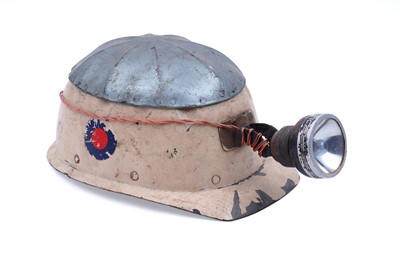 Lot 159 - Three helmets; and a collection of electric lights