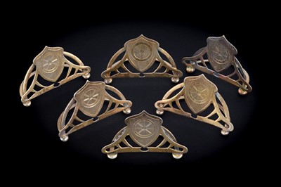 Lot 341 - An Edwardian/George V set of six silvergilt menu card holders