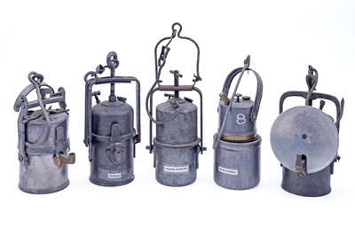 Lot 190 - A collection of nine early 20th Century carbide lamps