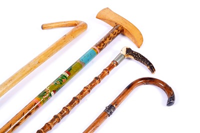 Lot 383 - A collection of walking sticks and canes