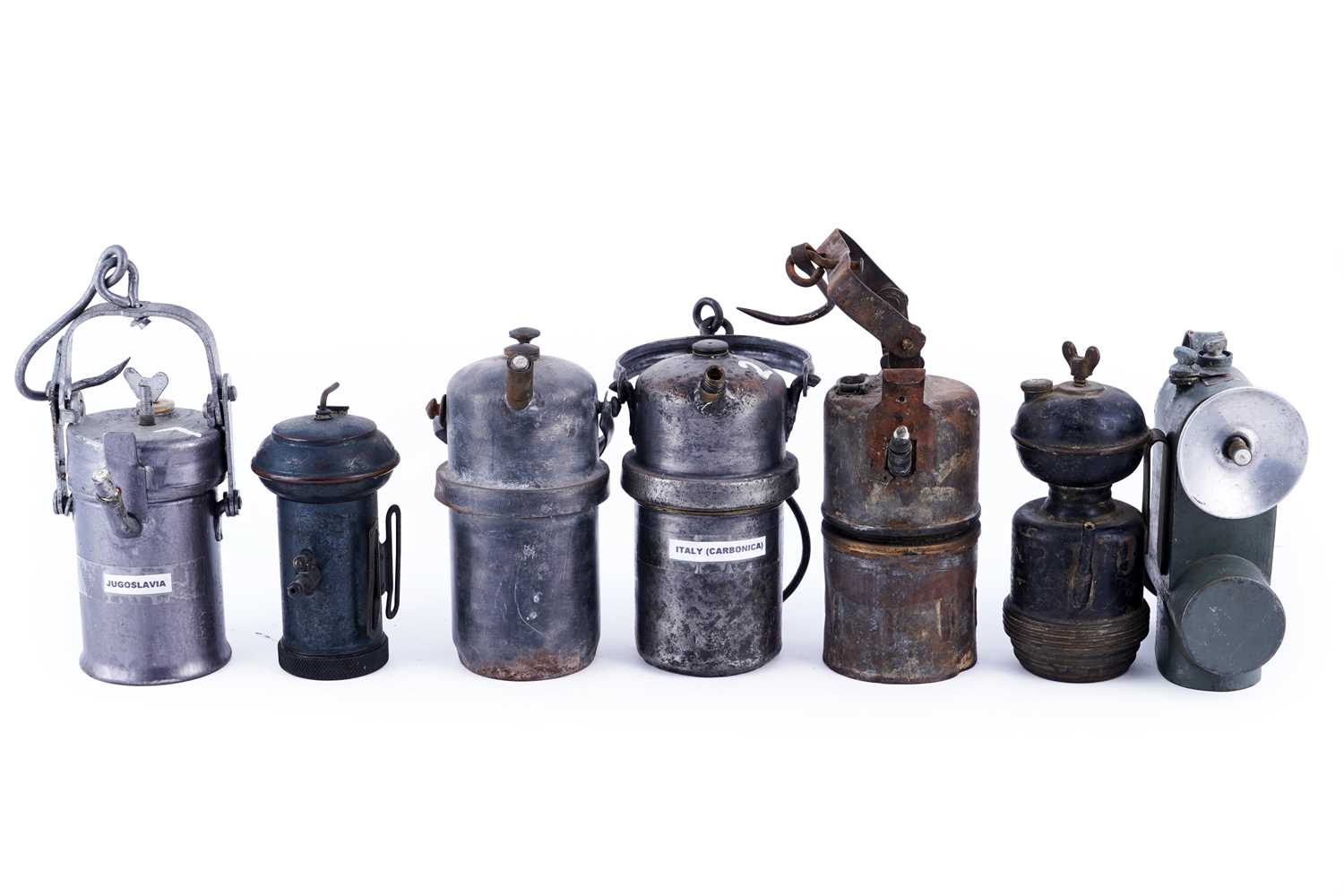 Lot 188 - A collection of seven carbide lamps