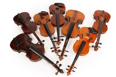 Lot 297 - A selection of seven violins; and two cases