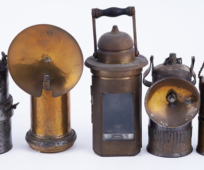 Lot 172 - A collection of seven carbide lamps