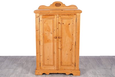 Lot 99 - An early to mid-20th Century pine housekeeper’s cupboard