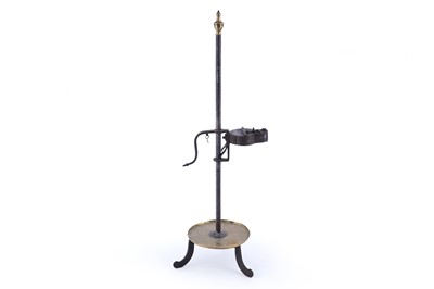 Lot 257 - A 19th Century ‘Frog’ type miner’s lamp raised on wrought iron standish