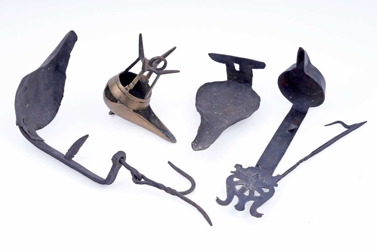 Lot 239 - Three 18/19th Century wrought iron ‘Betty’ lamps; and one brass