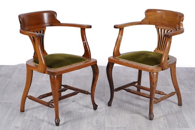 Lot 72 - A pair of early 20th Century oak smoker’s office chairs