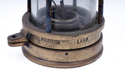 Lot 233 - Four ‘Protector’ type miners’ lamps