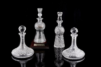 Lot 282 - A collection of four cut glass decanters