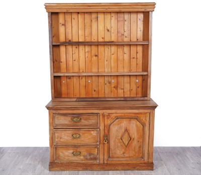 Lot 101 - A late 19th/early 20th Century pine dresser