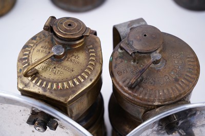 Lot 209 - A collection of brass ‘Guys Dropper’ type carbide lamps