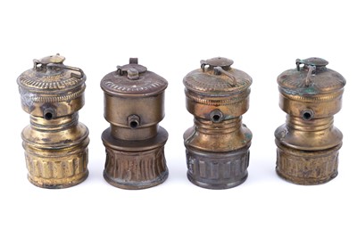 Lot 209 - A collection of brass ‘Guys Dropper’ type carbide lamps