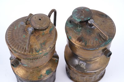 Lot 209 - A collection of brass ‘Guys Dropper’ type carbide lamps