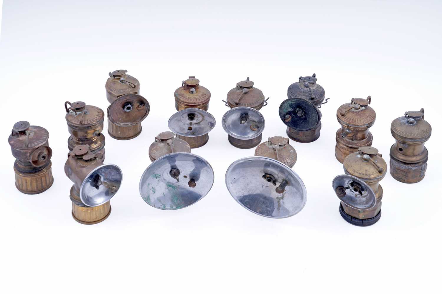 Lot 243 - A collection of brass ‘Guys Dropper’ type carbide lamps