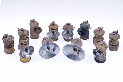 Lot 243 - A collection of brass ‘Guys Dropper’ type carbide lamps