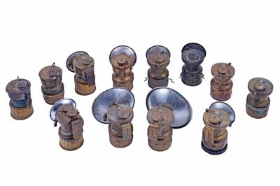 Lot 243 - A collection of brass ‘Guys Dropper’ type carbide lamps