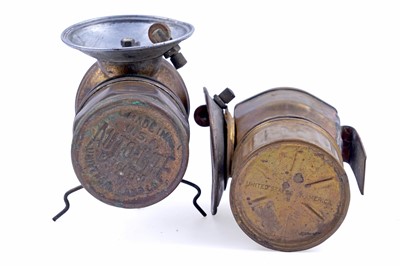 Lot 243 - A collection of brass ‘Guys Dropper’ type carbide lamps