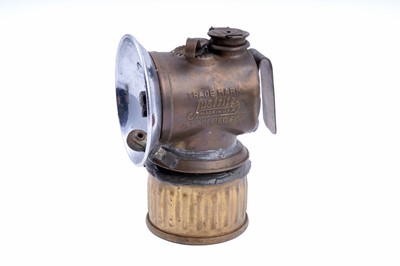 Lot 243 - A collection of brass ‘Guys Dropper’ type carbide lamps