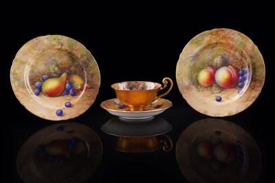 Lot 399 - A Royal Worcester fruit-painted cup, saucer, and two plates