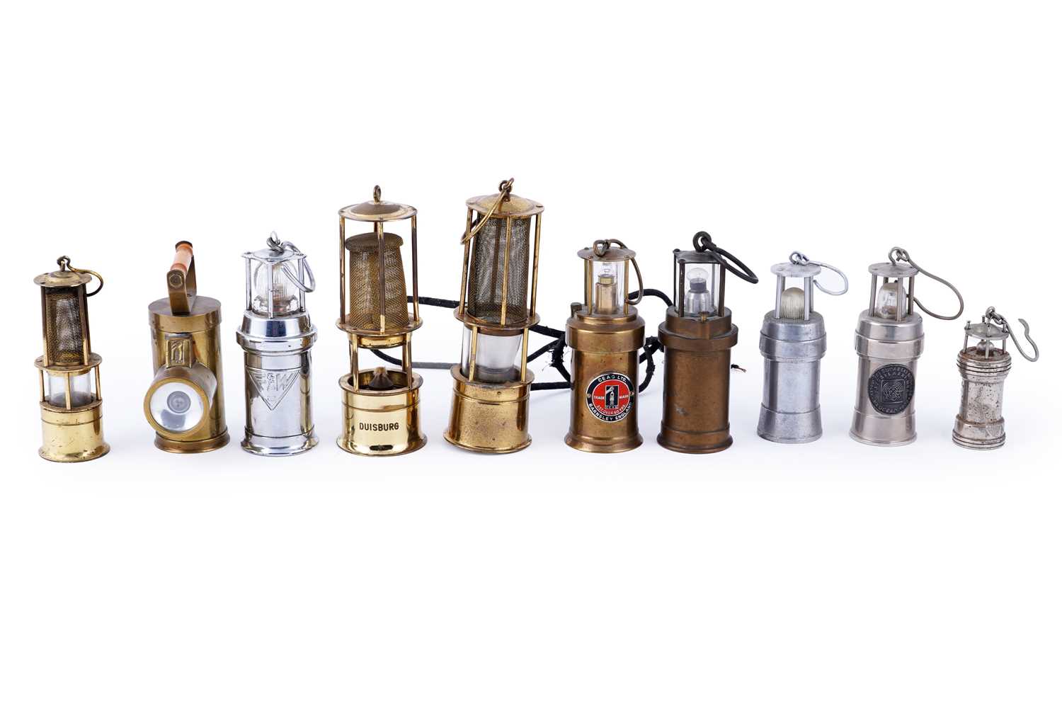 Lot 169 - A collection of miniature brass model lamps