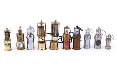 Lot 169 - A collection of miniature brass model lamps