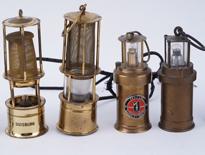 Lot 169 - A collection of miniature brass model lamps