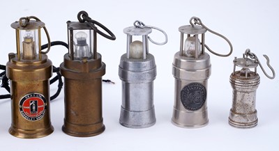 Lot 169 - A collection of miniature brass model lamps