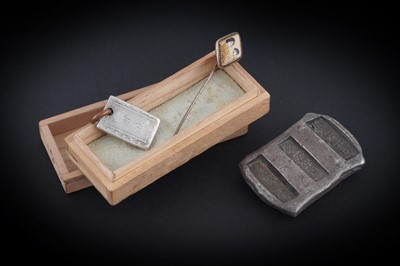 Lot 300 - A 19th Century Chinese silver sycee ingot; and others