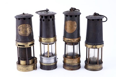 Lot 185 - A collection of four ‘Protector’ type lamps