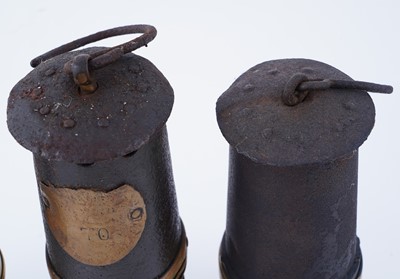 Lot 185 - A collection of four ‘Protector’ type lamps