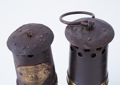 Lot 185 - A collection of four ‘Protector’ type lamps