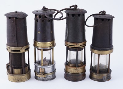 Lot 185 - A collection of four ‘Protector’ type lamps