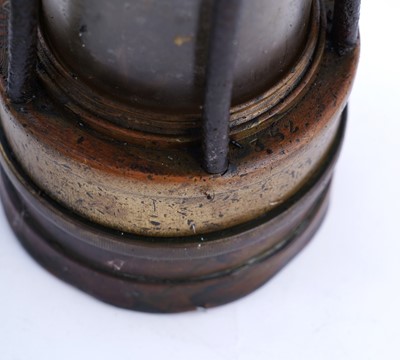 Lot 185 - A collection of four ‘Protector’ type lamps