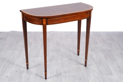 Lot 53 - A Regency-style mahogany and cross banded D-end console table