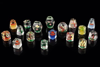 Lot 275 - A collection of Chinese and other similar cut glass paperweights